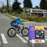 Kids biking into school on School Street at Genesee Hill Elementary